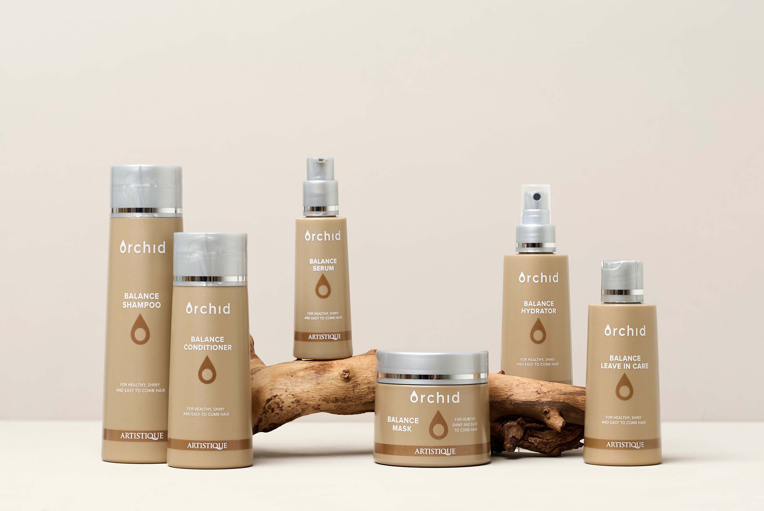 Product photography for Artistique - hair styling product with professional lighting and creative composition